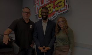 three people posing together in a studio